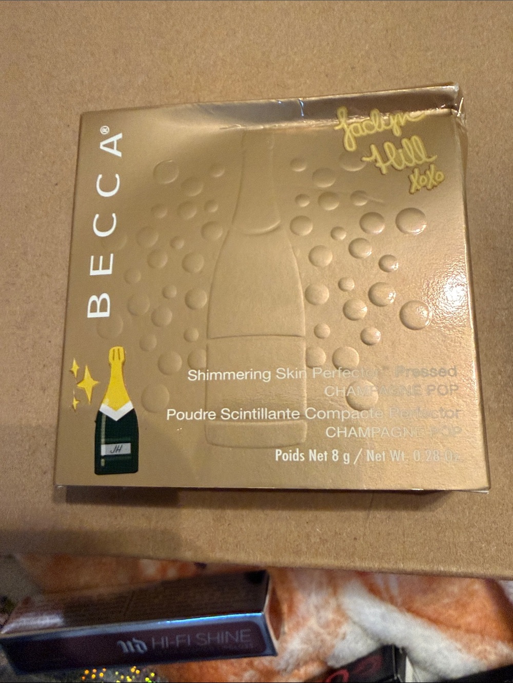BECCA Champagne Pop Highlighter Compact in Metallic Gold